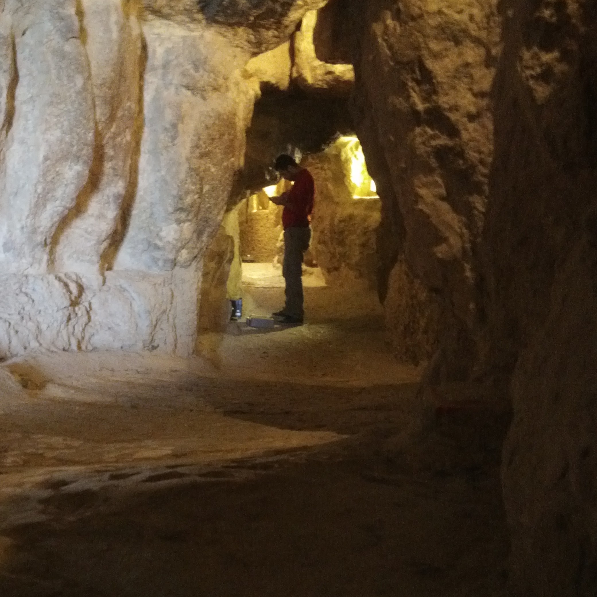 researcher standing in a tunnel within the great pyramid of giza taking measurements researcher standing in a tunnel within the great pyramid of giza taking measurements